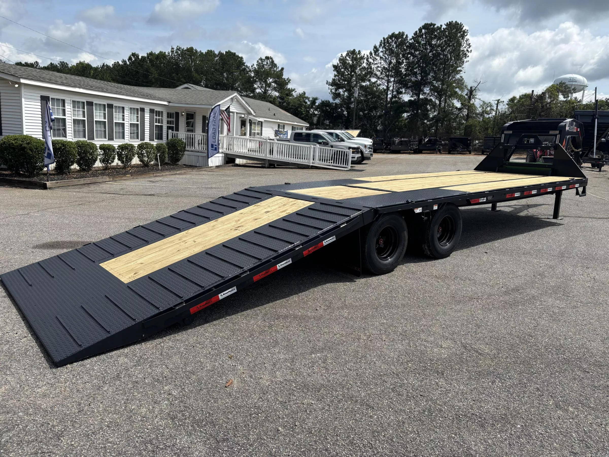 2025 RawMaxx HTX 102X32 DUAL TANDEM 11' HYDRAULIC DOVE AND HYDRAULIC JACKS 24K GVWR Flatbed Trailer