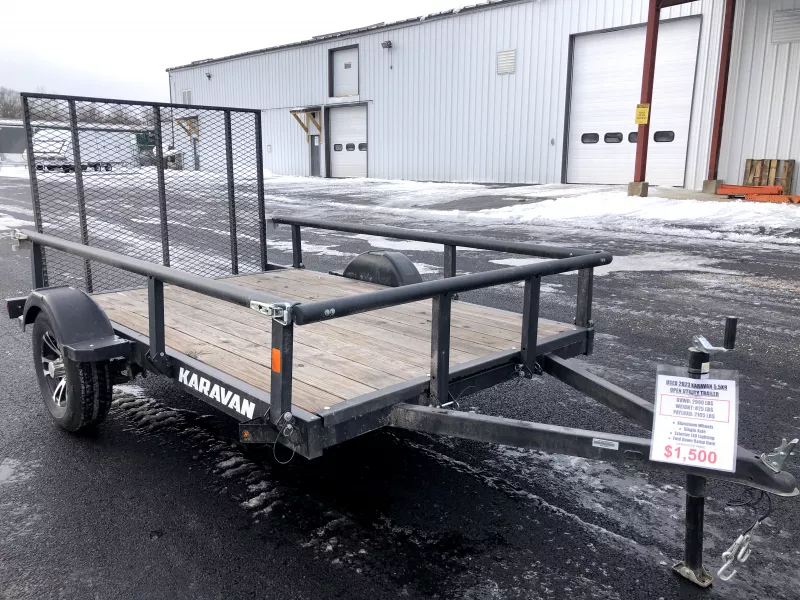USED 2023 Karavan 5.5X9 Utility Trailer w/Rear Ramp Gate. 825 lbs.