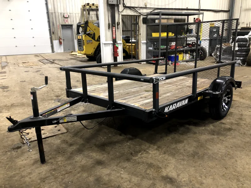 USED 2025 Karavan 5.5X9 Utility Trailer w/Rear Ramp Gate. 825 lbs.