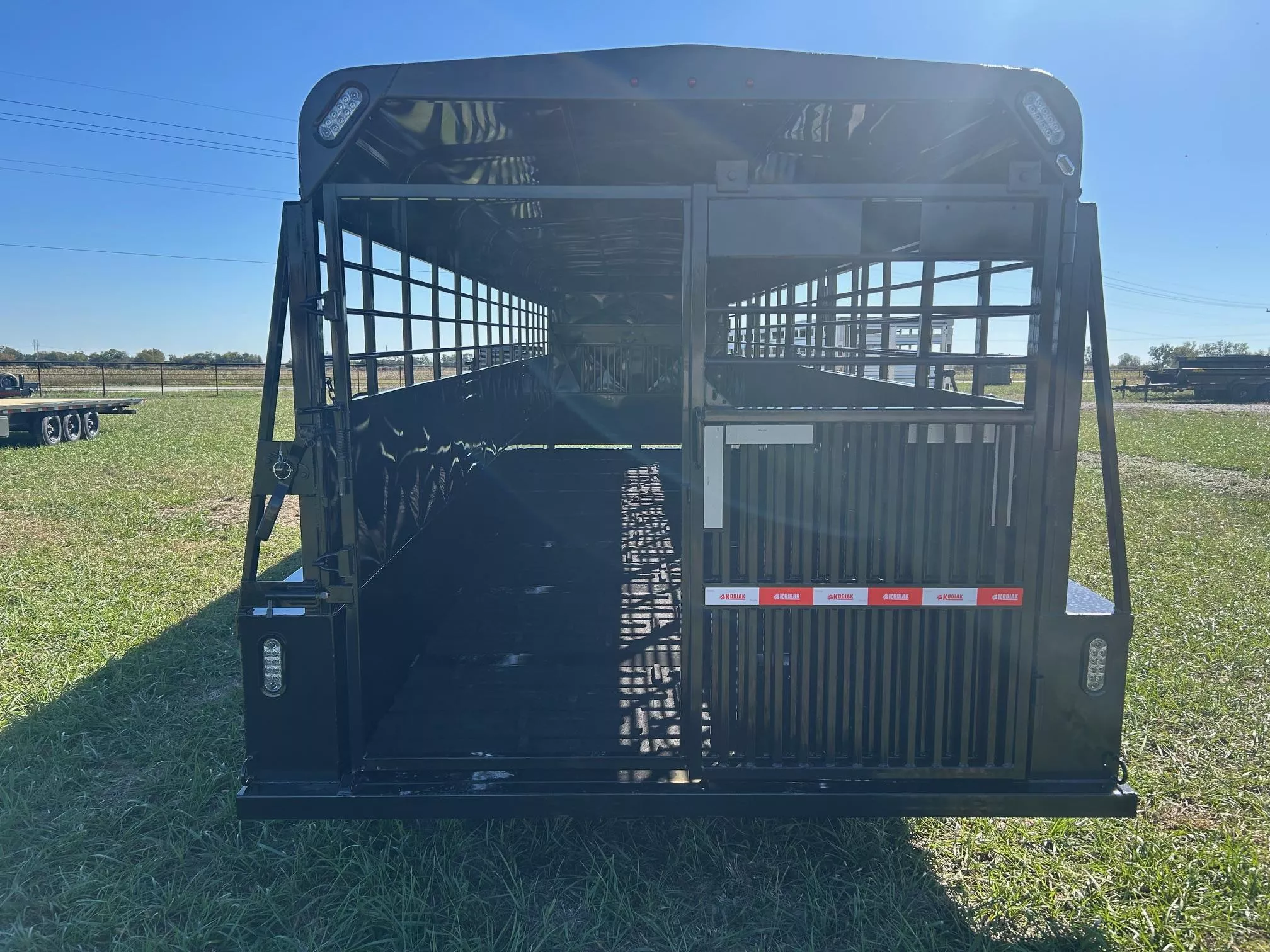 2026 Kodiak 6'8x28 Triple 21K GN Livestock Trailer w/ Swing/Slide