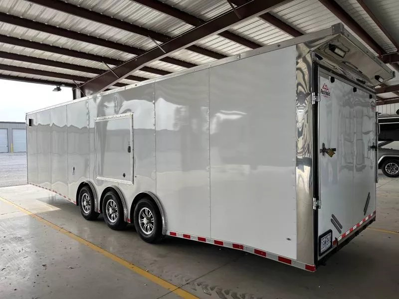 2023 Rock Solid 8.5X32 TRIPLE 21K SPREAD AXLE CARGO W/DRIVERS SIDE ESCAPE