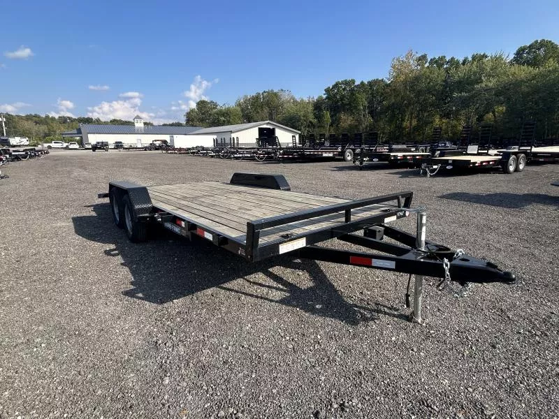 USED 2023 USED 2023 Sure-Trac 7x18 Wood Deck Car Hauler 7000# GVW * REAR SLIDE OUT PUNCH PLATE FINGERJOINTED RAMPS * DIAMOND PLATE FENDERS * SEALED WIRING HARNESS * SET BACK JACK * STAKE POCKETS/D-RINGS * DIAMOND PLATE DOVETAIL