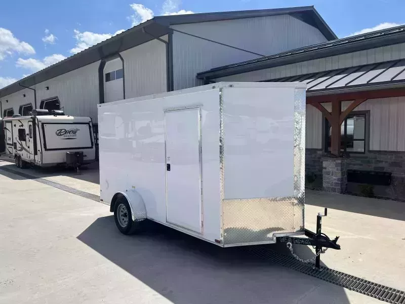 2026 Quality Cargo 6x12 Single Axle Enclosed Cargo Trailer 2990# GVW * WHITE .080 POLYCOR EXTERIOR * 6'3 CEILING HEIGHT * SEMI-SCREWLESS * PLYWOOD WALLS AND FLOOR * RV DOOR * 16" O.C. * TUBE STUDS * RAMP DOOR * V-NOSE
