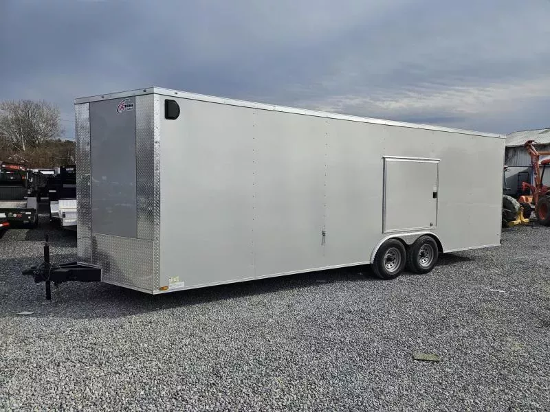 2026 Xtreme Cargo 8.5x24 Enclosed Car Hauler Trailer 9990# GVW * SILVER EXTERIOR * ESCAPE DOOR * 7' HEIGHT UTV PKG * 5200# AXLES * .080 POLYCOR SEMI-SCREWLESS * RV DOOR * PLYWOOD WALLS AND FLOOR * TUBE STUDS * D-RINGS * 6" TUBE FRAME