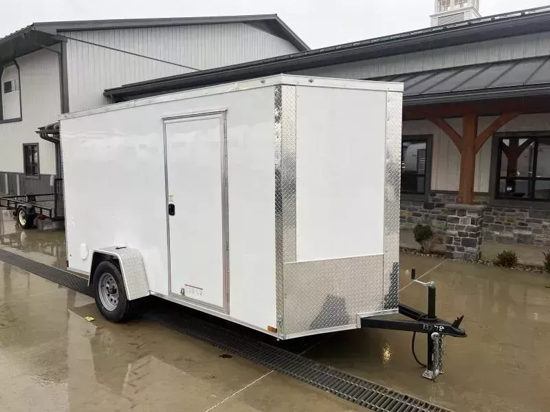 2026 Xtreme Cargo 6x12' Enclosed Cargo Trailer 2990# GVW * 6'3" HEIGHT * 16" FLOOR CROSSMEMBERS * WHITE EXTERIOR * .080 POLYCOR SEMI-SCREWLESS * RV DOOR * PLYWOOD WALLS AND FLOOR * TUBE STUDS