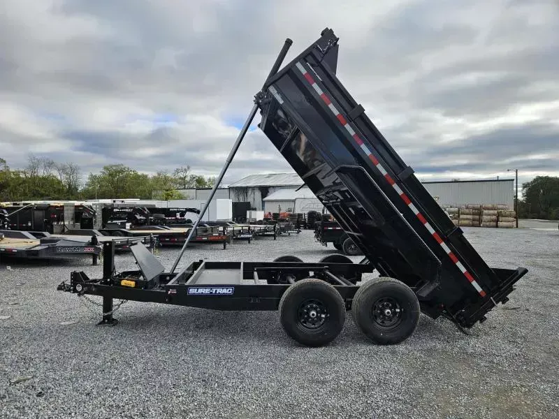 2026 Sure-Trac 7x12' Dump Trailer 14000# GVW * HYDRAULIC JACK * DELUXE TARP KIT * TELESCOPIC HOIST * FRONT/REAR BULKHEAD * INTEGRATED KEYWAY * 2' SIDES * UNDERBODY TOOL TRAY * ADJUSTABLE COUPLER * COMBO GATE