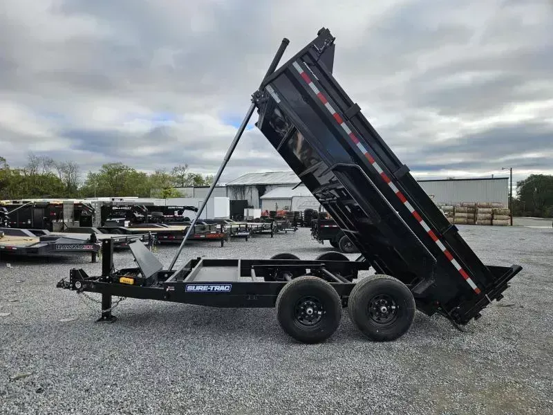 2026 Sure-Trac 7x12' Dump Trailer 14000# GVW * HYDRAULIC JACK * DELUXE TARP KIT * TELESCOPIC HOIST * FRONT/REAR BULKHEAD * INTEGRATED KEYWAY * 2' SIDES * UNDERBODY TOOL TRAY * ADJUSTABLE COUPLER * COMBO GATE