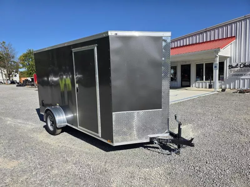 2026 Quality Cargo 6x12 Single Axle Enclosed Cargo Trailer 2990# GVW * CHARCOAL .080 POLYCOR EXTERIOR * 6'3 CEILING HEIGHT * SEMI-SCREWLESS * PLYWOOD WALLS AND FLOOR * RV DOOR * 16" O.C. * TUBE STUDS * RAMP DOOR * V-NOSE