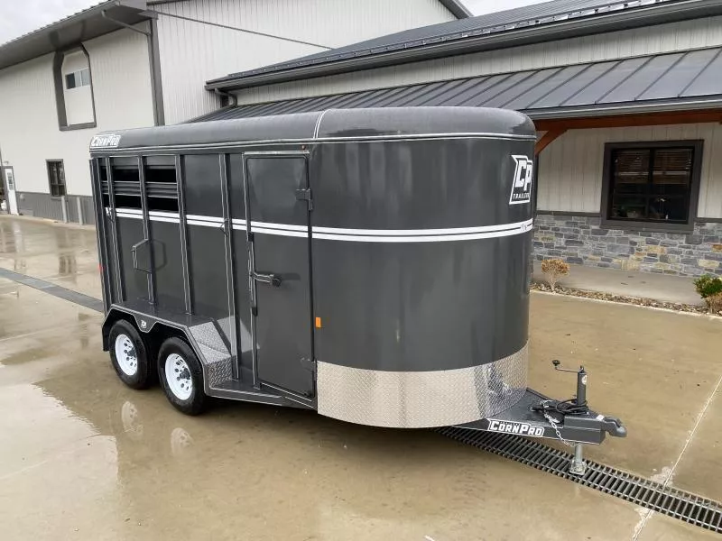 2025 Corn Pro 7x14' Livestock Trailer 7000# GVW * GRAY * TORSION SUSPENSION * DEXTER AXLES * 225/75/R15 8-PLY TIRES * HD FENDERS * CENTER AND REAR SLAM GATES * 4" CHANNEL TONGUE * URETHANE PAINT * KILN DRIED LUMBER * 7' HEIGHT * 7; WIDTH * 2 HORSE SLANT