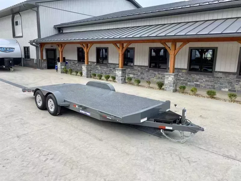 2026 Sure-Trac 7x20' Deluxe Steel Deck Car Hauler 9900# GVW * WINCH PLATE * TOOLBOX * CHARCOAL * REMOVABLE FENDERS * 4' BEAVERTAIL * LOW LOAD ANGLE * ALUMINUM WHEELS * 5" TUBE TONGUE/FRAME * AIR DAM * RUBRAIL/STAKE POCKETS/D-RINGS * FULL SEAMS WELDS