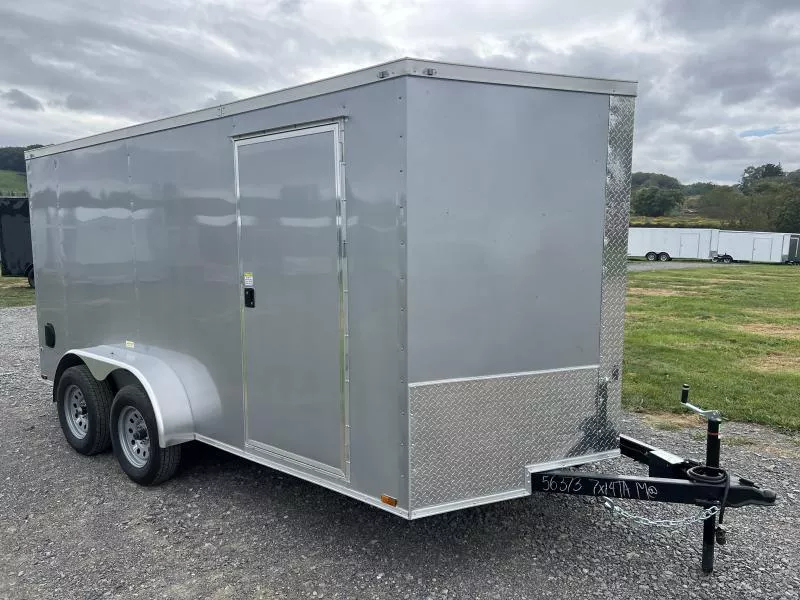 2026 Quality 7x14' Tandem Axle Enclosed Cargo Trailer 7000# GVW * 6'3" HEIGHT * SILVER EXTERIOR * RAMP DOOR * PLYWOOD WALLS & FLOORS * TUBE WALL AND CEILING STUDS * LED LIGHTS * 16" O.C. WALL AND FLOORS * RV DOOR * V-NOSE