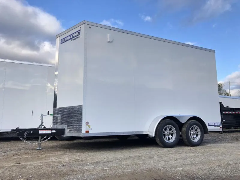 2026 Sure-Trac 7x14' Pro Series Enclosed Cargo Trailer 7000# GVW * WHITE EXTERIOR * TORSION * V-NOSE * RAMP * .030 SCREWLESS EXTERIOR * ALUMINUM WHEELS * 1 PC ROOF * 6'6" HEIGHT * 6" FRAME * 16" O.C. C/M * PLYWOOD * TUBE STUDS