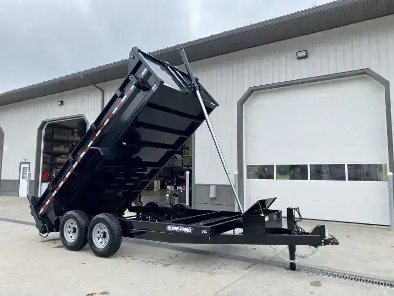 2026 Sure-Trac 7x14' Dump Trailer 14000# GVW * DELUXE TARP KIT * TELESCOPIC HOIST * FRONT/REAR BULKHEAD * INTEGRATED KEYWAY * 2' SIDES * UNDERBODY TOOL TRAY * ADJUSTABLE COUPLER * 110V CHARGER * UNDERMOUNT RAMPS * COMBO GATE
