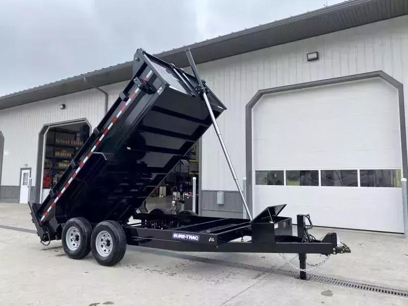 2025 Sure-Trac 7x14' Dump Trailer 14000# GVW * DELUXE TARP KIT * TELESCOPIC HOIST * FRONT/REAR BULKHEAD * INTEGRATED KEYWAY * 2' SIDES * UNDERBODY TOOL TRAY * ADJUSTABLE COUPLER * 110V CHARGER * UNDERMOUNT RAMPS * COMBO GATE