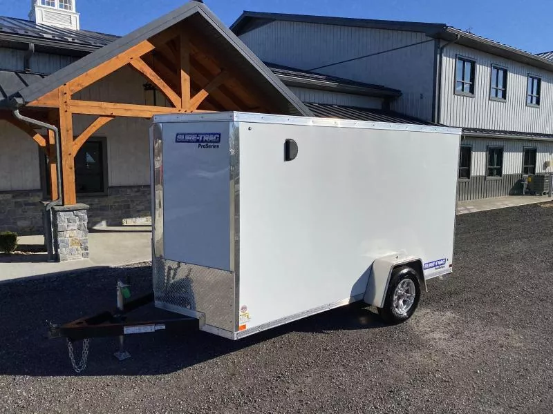 2026 Sure-Trac 6x10' STW Enclosed Cargo Trailer 2990#GVW * RAMP DOOR * WHITE EXTERIOR * ALUMINUM WHEELS * RV DOOR * 1 PC ROOF * .030 SCREWLESS EXTERIOR * 4" FRAME * TUBE STUDS