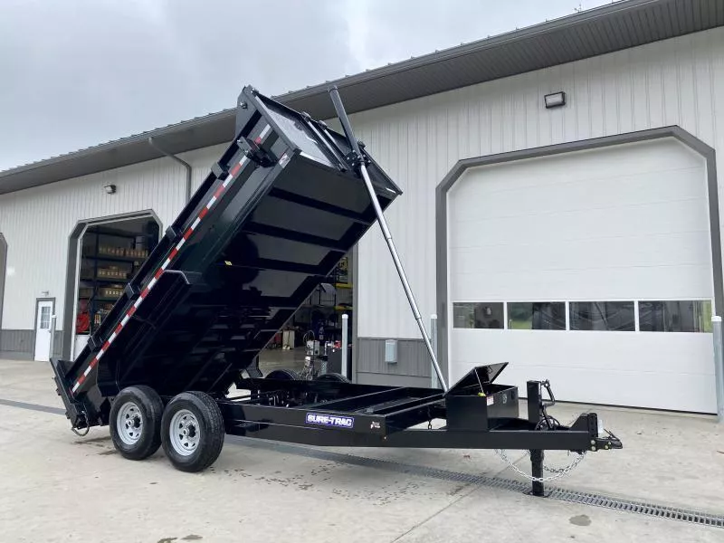 2025 Sure-Trac 7x14' Dump Trailer 14000# GVW * DELUXE TARP KIT * TELESCOPIC HOIST * FRONT/REAR BULKHEAD * INTEGRATED KEYWAY * 2' SIDES * UNDERBODY TOOL TRAY * ADJUSTABLE COUPLER * 110V CHARGER * UNDERMOUNT RAMPS * COMBO GATE