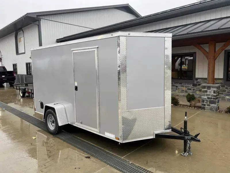2026 Xtreme Cargo 6x12' Enclosed Cargo Trailer 2990# GVW * 6'3" HEIGHT * 16" FLOOR CROSSMEMBERS * SILVER EXTERIOR * .080 POLYCOR SEMI-SCREWLESS * RV DOOR * PLYWOOD WALLS AND FLOOR * TUBE STUDS