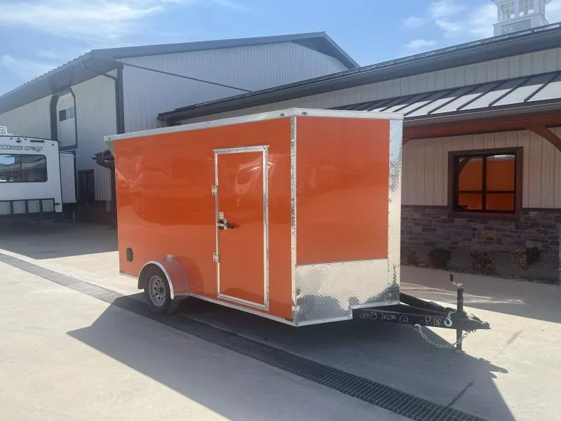 2025 Quality 7x12' Single Axle Enclosed Cargo Trailer 3500# GVW * .080 POLYCOR * ORANGE EXTERIOR * RAMP DOOR * PLYWOOD WALLS & FLOORS * TUBE WALL AND CEILING STUDS * LED LIGHTS * 16" O.C. WALL AND FLOORS * RV DOOR * V-NOSE * SPOILER *