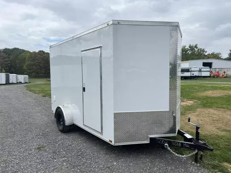 2026 Quality 7x12' Single Axle Enclosed Cargo Trailer 3500# GVW * BLACK .080 POLYCOR EXTERIOR * ELECTRIC BRAKES * 4" FRAME * RAMP DOOR * PLYWOOD WALLS & FLOORS * TUBE WALL AND CEILING STUDS * 16" O.C. WALL AND FLOOR * RV DOOR * V-NOSE