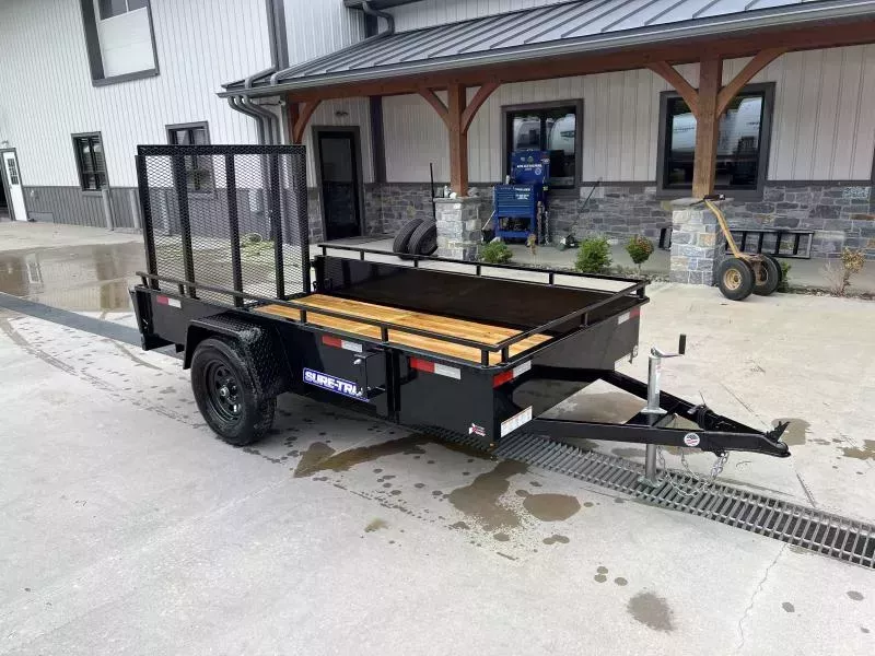 2026 Sure-Trac 5x10' Solid Side Utility Landscape Trailer 2990# GVW * 2X2" TUBE GATE C/M + SPRING ASSIST * FOLD FLAT GATE * TOOLESS GATE REMOVAL * SPARE MOUNT * PROTECTED WIRING * SET BACK JACK * HD FENDERS * TUBE BUMPER * HIGH SIDE