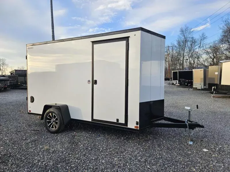 2026 ITI Cargo 7x12' Enclosed Cargo Trailer 2990# GVW * 4 D-RINGS * 4" FRAME * 7' HEIGHT * WHITE BLACKOUT EXTERIOR * SCREWLESS EXTERIOR * BLACK ALUMINUM WHEELS * 16" O.C. WALLS * 1 PC ROOF * TRUCKBED LINER TONGUE & SILLS * UNDERCOATED * VAPOR BARRIER