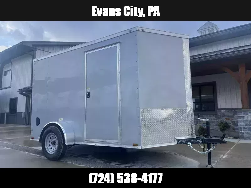 2026 Quality Cargo 6x12 Single Axle Enclosed Cargo Trailer 2990# GVW * 6'3 CEILING HEIGHT * SILVER EXTERIOR * PLYWOOD WALLS AND FLOOR * RV DOOR * 16" O.C. * TUBE STUDS * RAMP DOOR * V-NOSE 1776216970