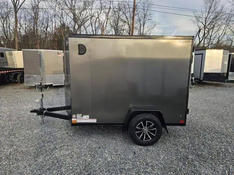 2026 ITI Cargo 5x8' Enclosed Cargo Trailer 2990# GVW * WHITE BLACKOUT EXTERIOR * SCREWLESS .030 EXTERIOR * BLACK ALUMINUM WHEELS * 16" O.C. WALLS * 1 PC ROOF * TRUCKBED LINER ON TONGUE AND SILLS * 4" FRAME * UNDERCOATED * VAPOR BARRIER