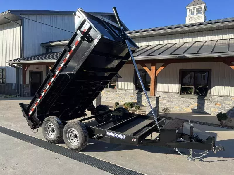 2026 Sure-Trac 7x12' Dump Trailer 12000# GVW * TARP KIT * TELESCOPIC HOIST * FRONT/REAR BULKHEAD * INTEGRATED KEYWAY * 2' SIDES * UNDERBODY TOOL TRAY * ADJUSTABLE COUPLER * 110V CHARGER * UNDERMOUNT RAMPS * COMBO GATE * 7K DROP LEG JACK * SPARE MOUNT