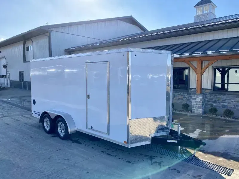 2026 Sure-Trac 7x16' Pro Series Enclosed Cargo Trailer 9900# GVW * 5200# TORSION SUSPENSION * WHITE EXTERIOR * V-NOSE * RAMP * .030 SCREWLESS EXTERIOR * ALUMINUM WHEELS * 1 PC ROOF * 6'6" HEIGHT * 6" FRAME * 16" O.C. C/M * PLYWOOD * TUBE STUDS