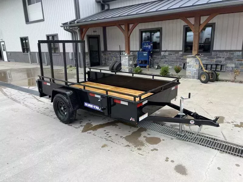 2026 Sure-Trac 5x10' Solid Side Utility Landscape Trailer 2990# GVW * 2X2" TUBE GATE C/M + SPRING ASSIST * FOLD FLAT GATE * TOOLESS GATE REMOVAL * SPARE MOUNT * PROTECTED WIRING * SET BACK JACK * HD FENDERS * TUBE BUMPER * HIGH SIDE