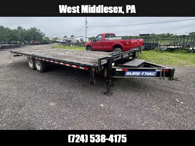 USED Sure-Trac 102x24' Power Tilt Deckover 17600# GVW * DUAL 12K JACKS * DUAL PISTON * 8000# AXLES * 17.5" 16-PLY TIRES * 3 3/8" BRAKES * 4X4X1/4" TUBE BED RUNNERS * RUBRAIL/STAKE POCKETS/PIPE SPOOLS/8 D-RINGS * LOW LOAD ANGLE