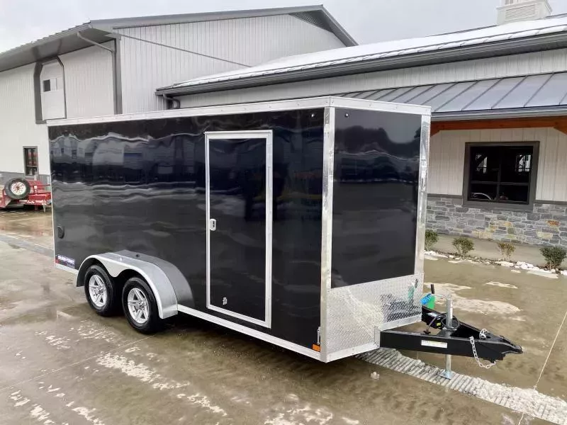 2026 Sure-Trac 7x16' Pro Series Enclosed Cargo Trailer 7000# GVW * TORSION * BLACK EXTERIOR * V-NOSE * RAMP * .030 SCREWLESS EXTERIOR * ALUMINUM WHEELS * 1 PC ROOF * 6'6" HEIGHT * 6" FRAME * 16" O.C. C/M * TUBE STUDS