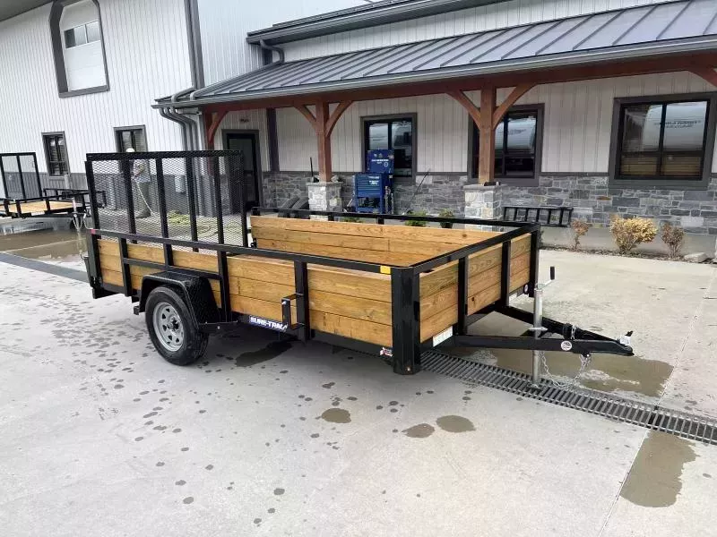 2026 Sure-Trac 7x12' High Side Utility Landscape Trailer 2990# GVW * 24" 3-BOARD HIGH SIDE * 2" TUBE TOP RAIL * 2X2" TUBE GATE C/M + SPRING ASSIST + FOLD FLAT * TOOLESS GATE REMOVAL * SPARE MOUNT * PROTECTED WIRING * SET BACK JACK