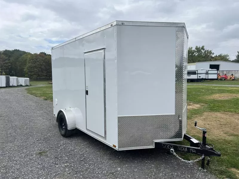 2026 Quality 7x12' Single Axle Enclosed Cargo Trailer 3500# GVW * WHITE .080 POLYCOR EXTERIOR * ELECTRIC BRAKES * 4" FRAME * RAMP DOOR * PLYWOOD WALLS & FLOORS * TUBE WALL AND CEILING STUDS * 16" O.C. WALL AND FLOOR * RV DOOR * V-NOSE