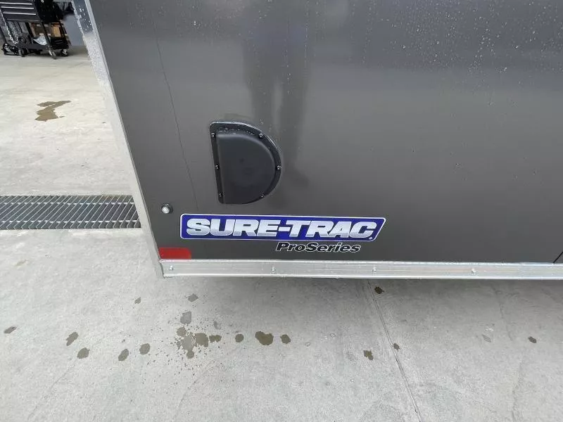 2026 Sure-Trac 8.5x24' Pro Series Enclosed Car Hauler Trailer 9900# GVW * CHARCOAL EXTERIOR * V-NOSE * 5200# AXLES * .030 SCREWLESS EXTERIOR * ALUMINUM WHEELS * 1 PC ROOF * 6" FRAME * 16" O.C. C/M * TUBE STUDS * 48" RV DOOR * 7K DROP JACK vSN7GSpx4c5g
