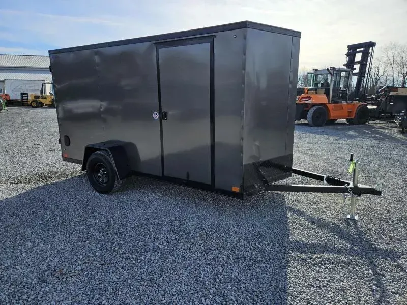 2026 ITI Cargo 7x12' Enclosed Cargo Trailer 2990# GVW * 4" FRAME * 7' HEIGHT * CHARCOAL BLACKOUT EXTERIOR * SCREWLESS .030 EXTERIOR * BLACK ALUMINUM WHEELS * 16" O.C. WALLS * 1 PC ROOF * TRUCKBED LINER ON TONGUE/SILLS * UNDERCOATED * VAPOR BARRIER