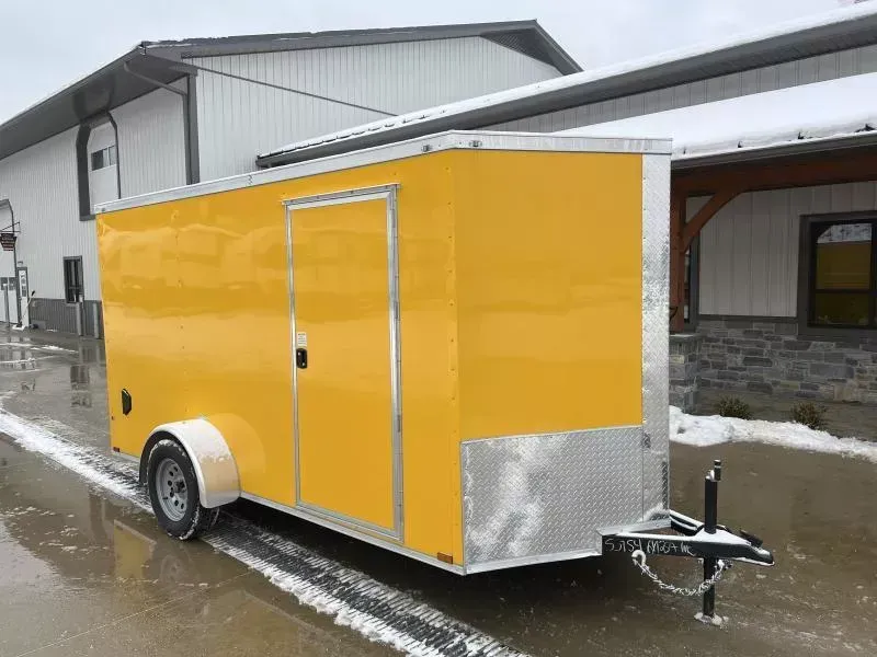 2025 Quality Cargo 6x12 Single Axle Enclosed Cargo Trailer 2990# GVW * 6'3 CEILING HEIGHT * ORANGE EXTERIOR * PLYWOOD WALLS AND FLOOR * RV DOOR * 16" O.C. * TUBE STUDS * RAMP DOOR * V-NOSE