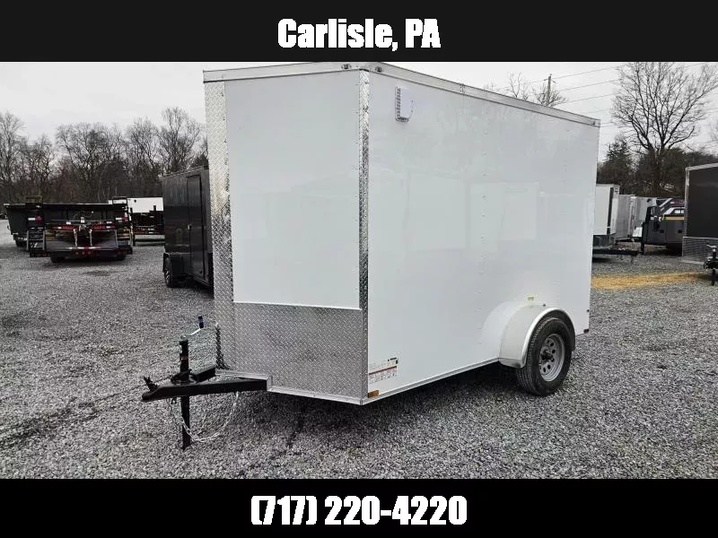 2026 Quality Cargo 6x10' Single Axle Enclosed Cargo Trailer 2990# GVW * WHITE .080 POLYCOR EXTERIOR * 6'9 CEILING HEIGHT * SEMI-SCREWLESS * PLYWOOD WALLS AND FLOOR * RV DOOR * 16" O.C. * TUBE STUDS * RAMP DOOR * V-NOSE