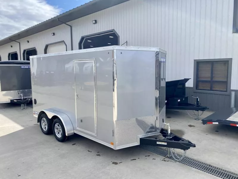2026 Sure-Trac 7x14' Pro Series Enclosed Cargo Trailer 7000# GVW * TORSION AXLES * SILVER EXTERIOR * V-NOSE * RAMP * .030 SCREWLESS EXTERIOR * ALUMINUM WHEELS * 1 PC ROOF * 6'6" HEIGHT * 6" FRAME * 16" O.C. C/M * PLYWOOD * TUBE STUDS