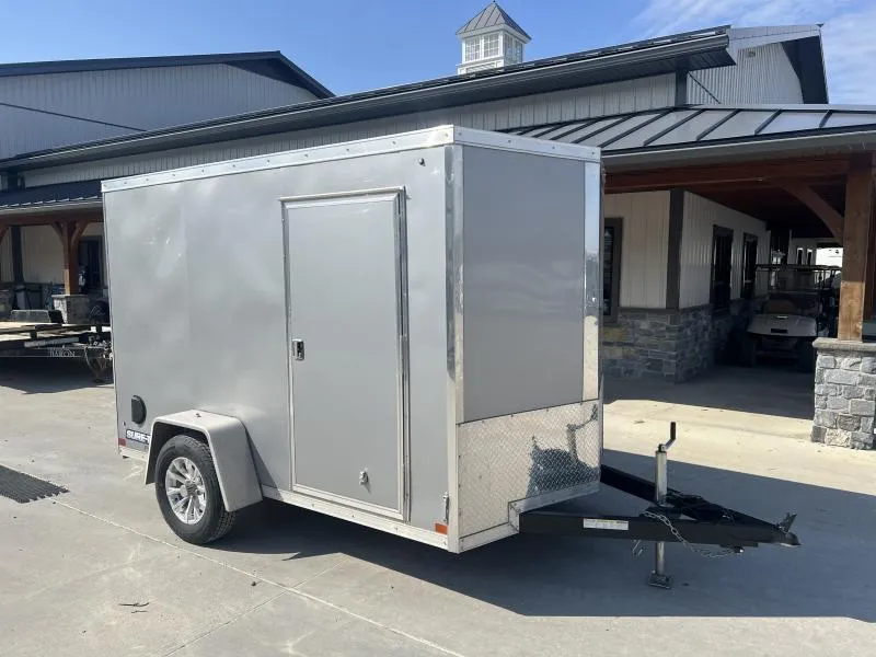 USED 2024 Sure-Trac 6x10' Pro Series Enclosed Cargo Trailer 2990# GVW * SILVER EXTERIOR * V-NOSE * RAMP * .030 SCREWLESS EXTERIOR * ALUMINUM WHEELS * 1 PC ROOF * 4" TUBE FRAME * 16" O.C. WALLS * TUBE STUDS * CEILING LINER * RV DOOR