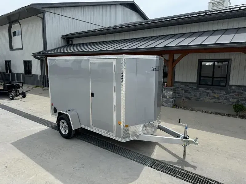 2026 EZ Hauler 6x12' Aluminum Enclosed Cargo Trailer 2990# GVW * WHITE .080 POLYCOR EXTERIOR * ALUMINUM WHEELS * SCREWLESS * ONE PC ROOF * DEXTER AXLES * RV DOOR * RAMP DOOR
