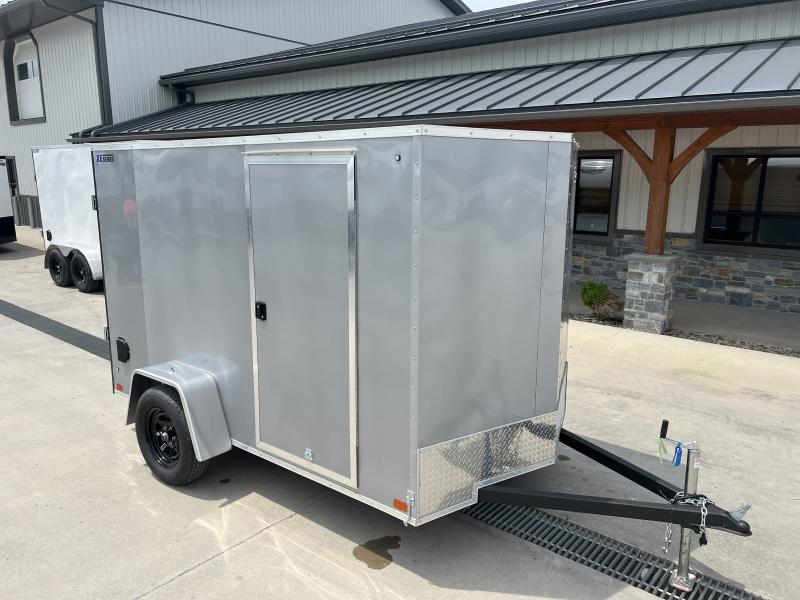 NEW ITI Cargo 6x10' Enclosed Cargo Trailer 2990# GVW * SILVER EXTERIOR * 16" O.C. FLOOR AND WALL UPGRADE * 030 SEMI-SCREWLESS EXTERIOR * RV DOOR * 1 PC ALUMINUM ROOF * TRUCKBED LINER ON TONGUE AND SILLS * UNDERCOATED * VAPOR BARRIER