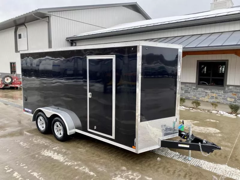 2026 Sure-Trac 7x16' Pro Series Enclosed Cargo Trailer 7000# GVW * TORSION * BLACK EXTERIOR * V-NOSE * RAMP * .030 SCREWLESS EXTERIOR * ALUMINUM WHEELS * 1 PC ROOF * 6'6" HEIGHT * 6" FRAME * 16" O.C. C/M * TUBE STUDS