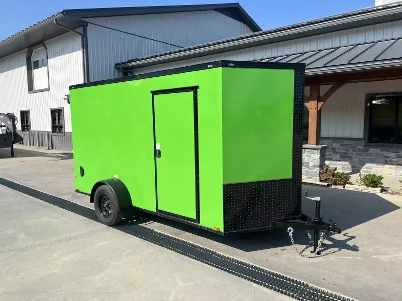 2025 Quality 7x12' Single Axle Enclosed Cargo Trailer 2990# GVW * 4" FRAME * 7' HEIGHT * BLACKOUT PKG * D-RINGS * ELECTRIC GREEN EXTERIOR * RAMP DOOR * PLYWOOD WALLS & FLOORS * TUBE WALL AND CEILING STUDS * 16" O.C. WALL AND FLOOR * RV DOOR * V-NOSE