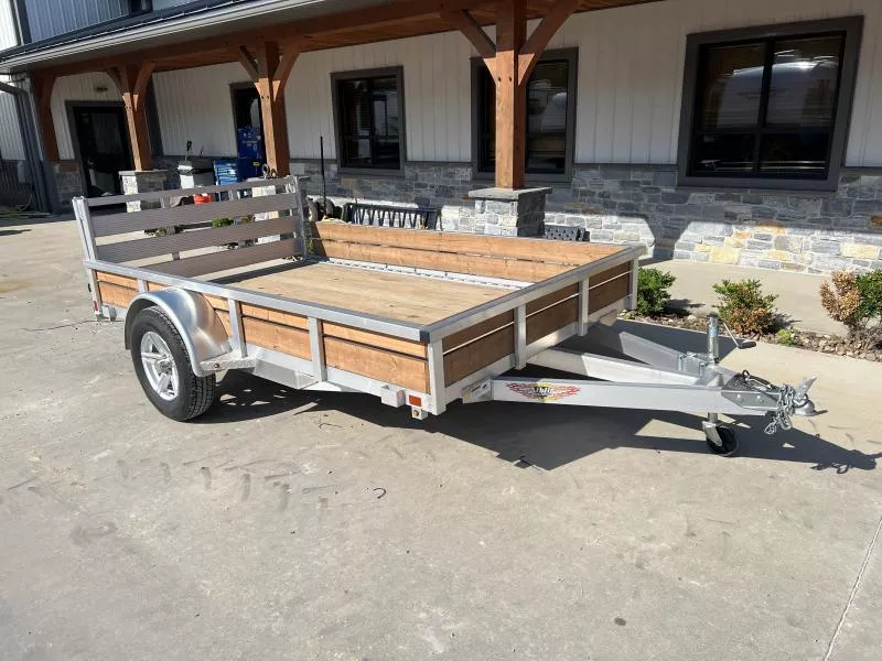 USED 2023 H&H 76x10' Aluminum Utility Landscape Trailer 2990# GVW *ADDED WOOD SIDES * BI FOLD GATE * ALUMINUM WHEELS * TUBE TOP * TRIPLE TUBE TONGUE * TUBE TONGUE * SWIVEL JACKS * STAKE POCKETS * EXTENDED 54" GATE
