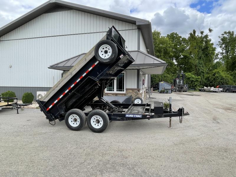 USED 2016 Sure-Trac 7x12' Dump Trailer 12000# GVW * DELUXE TARP KIT * SCISSOR HOIST * FRONT/REAR BULKHEAD * INTEGRATED KEYWAY * 2' SIDES * UNDERBODY TOOL TRAY * ADJUSTABLE COUPLER * 1' WOOD SIDE EXTENSIONS * UNDERMOUNT RAMPS * COMBO GATE * 7K DROP LEG JAC USED 2016 Sure-Trac 7x12' Dump Trailer 12000# GVW * DELUXE TARP KIT * SCISSOR HOIST * FRONT/REAR BULKHEAD * INTEGRATED KEYWAY * 2' SIDES * UNDERBODY TOOL TRAY * ADJUSTABLE COUPLER * 1' WOOD SIDE EXTENSIONS * UNDERMOUNT RAMPS * COMBO GATE * 7K DROP LEG JAC