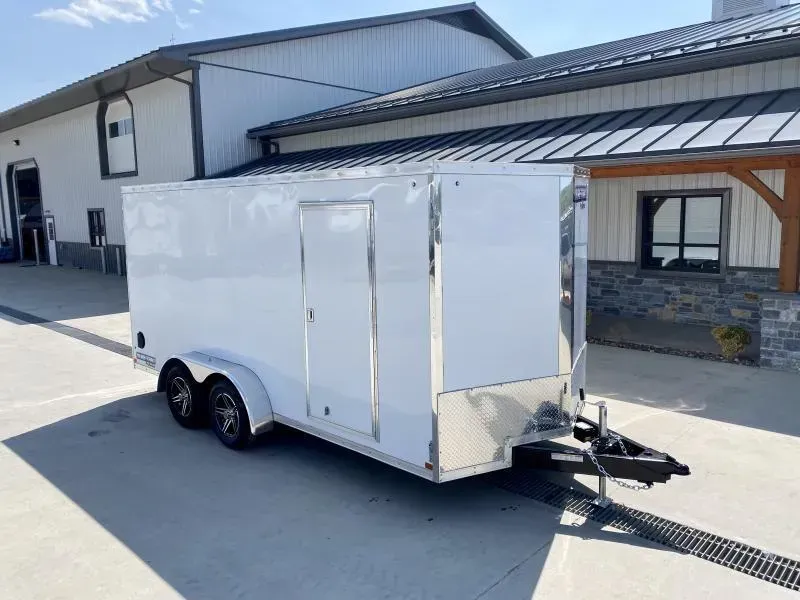 2026 Sure-Trac 7x16' Pro Series Enclosed Cargo Trailer 7000# GVW * TORSION * WHITE EXTERIOR * V-NOSE * RAMP * .030 SCREWLESS EXTERIOR * ALUMINUM WHEELS * 1 PC ROOF * 6'6" HEIGHT * 6" FRAME * 16" O.C. C/M * PLYWOOD * TUBE STUDS