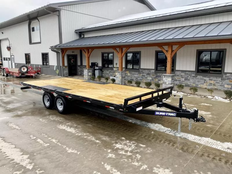 2026 Sure-Trac 102x18 Flatbed Deckover Trailer 9900# GVW * 8' SLIDE IN PUNCH PLATE RAMPS * TUBE SIDE RAIL + CROSSMEMBERS * RUBRAIL/STAKE POCKETS/D-RINGS * SPARE MOUNT * ADJUSTABLE COUPLER * DROP LEG JACK