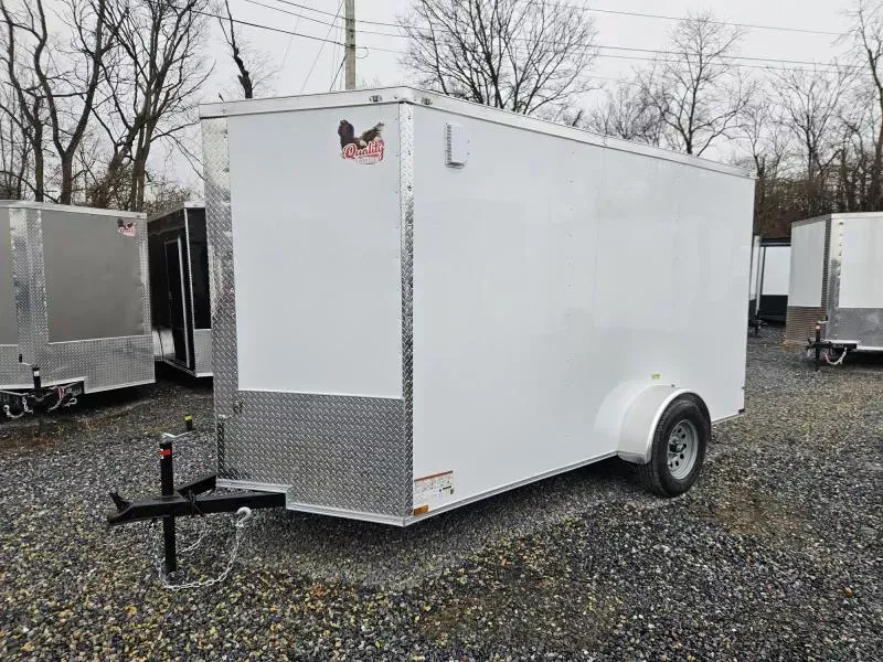 2026 Quality Cargo 6x10 Single Axle Enclosed Cargo Trailer 2990# GVW * WHITE .080 POLYCOR EXTERIOR * 6'3 CEILING HEIGHT * SEMI-SCREWLESS * PLYWOOD WALLS AND FLOOR * RV DOOR * 16" O.C. * TUBE STUDS * RAMP DOOR * V-NOSE