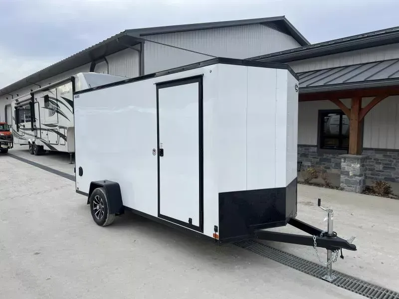 2026 ITI Cargo 6x12' Enclosed Cargo Trailer 2990# GVW * 4" FRAME * 6'6" H * WHITE BLACKOUT EXTERIOR * SCREWLESS .030 EXTERIOR * BLACK ALUMINUM WHEELS * 16" O.C. WALLS * RV DOOR * 1 PC ROOF * TRUCKBED LINER TONGUE & SILLS * UNDERCOATED * VAPOR BARRIER
